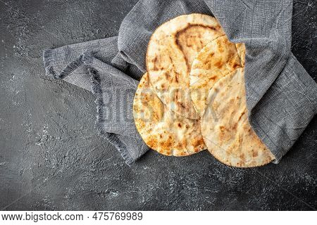Pita Bread On A Wooden Board. Traditional Arabic Cuisine. Banner, Menu, Recipe Place For Text, Top V