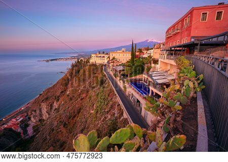 Taormina, Sicily, Italy. Cityscape Image Of Picturesque Town Of Taormina, Sicily With Volcano Mt. Et