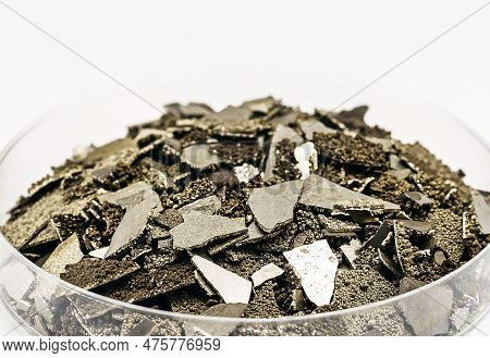 Manganese Samples In Petri Dish, Pure Manganese Metal Flakes Used In Industry, Isolated White Backgr