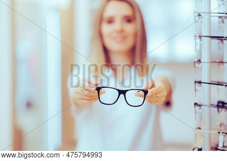 Eye Doctor Giving A Pair Of Glasses To A Myopic Patient