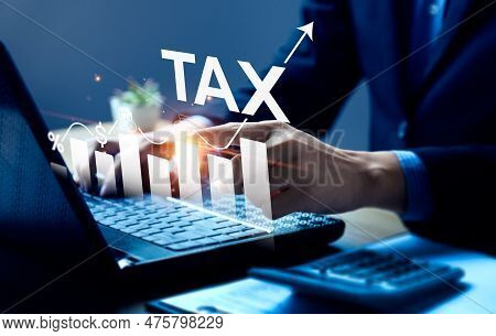 Businessman Calculating Annual Taxes And Paying Taxes. Tax Deduction Planning Concept. Expenses, Acc
