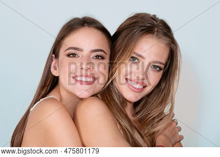 Close-up Of Couple Beautiful Happy Smiling Girlfriends Models. Two Attractive Sexy Sensual Women Emb