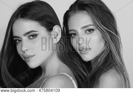 Close-up Of Couple Beautiful Girlfriends Models. Two Attractive Sexy Sensual Women Embrace, Friendly