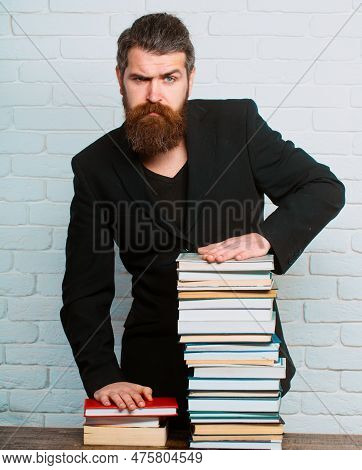 Serious Teacher Or Professor With Book Stack. Thinking Serious Mature Teacher. Mature Professor, Mid