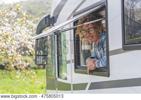 Portrait Of Cheerful Tourist Enjoying Destination Parking With Camper Van Vehicle Smiling Outside Th