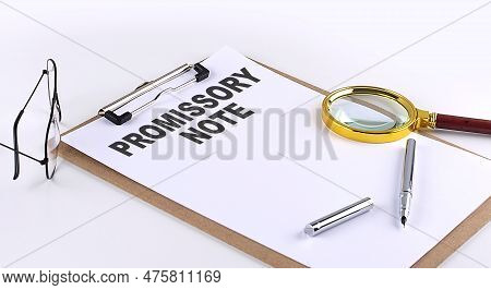 Promissory Note Text On A Clipboard On White Background, Business Concept