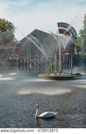 City Fountain And Pond With Swan And Ducks In Old European City Bietigheim-bissingen In Germany. The