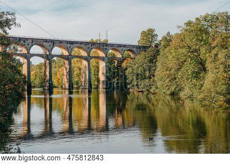 Railway Bridge With River In Bietigheim-bissingen, Germany. Autumn. Railway Viaduct Over The Enz Riv