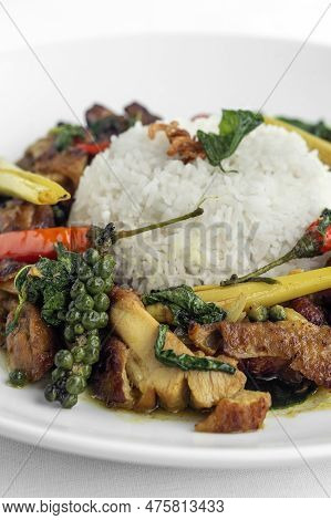 Pad Krapow Gai Spicy Thai Chicken Vegetable Stir Fry On White Plate