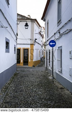 Evora, Portugal- October 10, 2022:typical Portuguese Facades And Cobblestone Streets In Evora Town, 