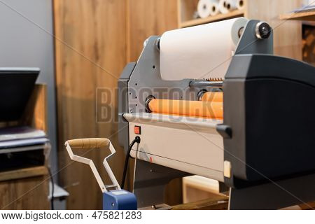 Professional Print Plotter With Paper Roll In Print Center.