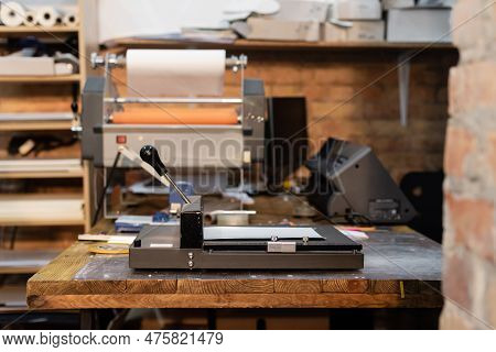 Modern Paper Trimmer And Print Plotter Machine In Print Center.