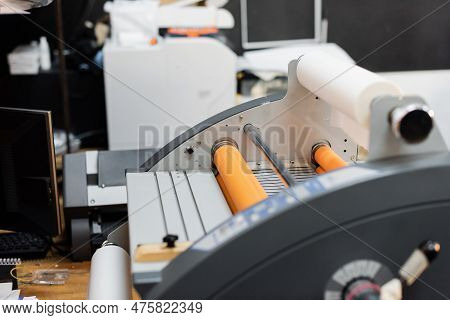 Paper Roll Inside Of Professional Print Plotter In Copy Center.