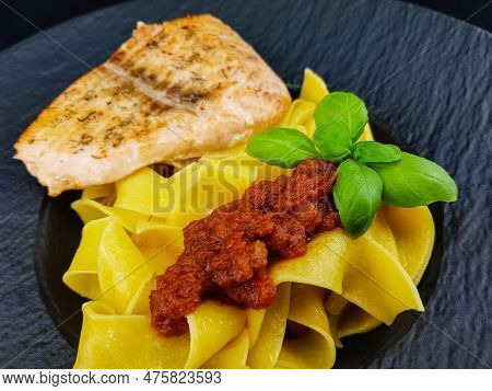 Italian Pappadelle Pasta With A Roasted Salmon Steak And Vegetables