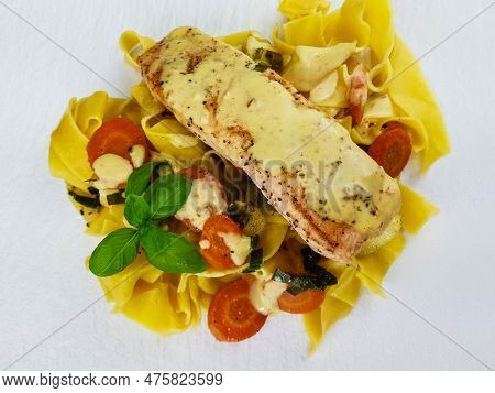 Italian Pappadelle Pasta With A Roasted Salmon Steak And Vegetables