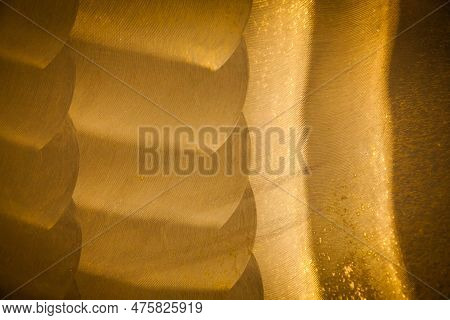 Part Of The Ship's Bronze Propeller, Close-up. New Polished Bronze Texture. Uneven Surface Of Polish
