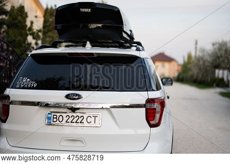Ternopil, Ukraine -may, 2023: Ford Explorer Family Car With Roof Rack Thule Motion Xxl Box In Ukrain