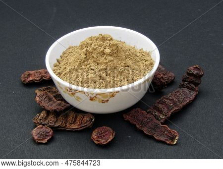 Shikakai Or Acacia Concinna Powder In A Bowl On Black Background