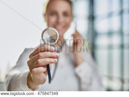 Female Physician Healthcare Professional Showing Medical Equipme
