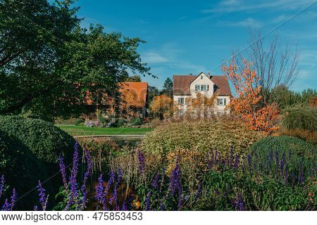 House With Nice Garden In Fall. Flowers In The City Park Of Bietigheim-bissingen, Baden-wuerttemberg