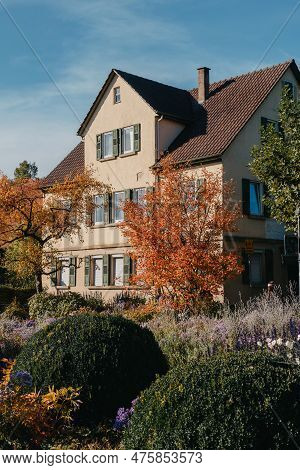 House With Nice Garden In Fall. Flowers In The City Park Of Bietigheim-bissingen, Baden-wuerttemberg