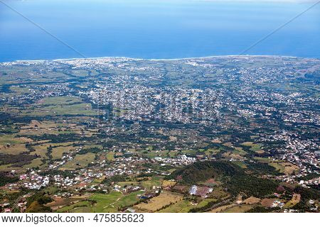 Aerial View Of The Plaine Des Cafres And The Indian Ocean With The Town Of Saint-pierre And Le Tampo