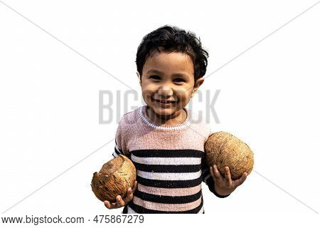 Cute Asian Little Boy Holding Two Coconuts To Drink Water With His  Happiness.