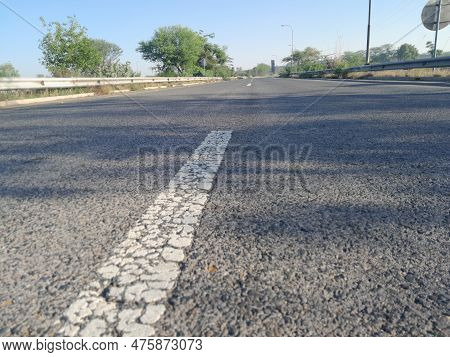 Road Closeup Located In A Moterway Side