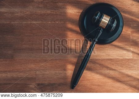 Closeup Top View Black Wooden Gavel Hammer On Wooden Office Desk Background As Justice And Legal Sys