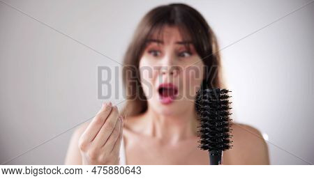 Hairfall And Hairloss. Worried Woman With Hair Loss