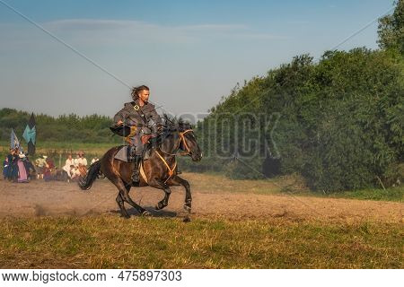 Gniew, Poland, Aug 2020 Closeup On Warrior, A Soldier, Riding A Horse On Battlefield, Historical Ree