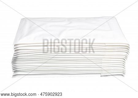 Close-up Of A Stack Of White Padded Mailers Isolated On A White Background. Post Industry Related Pr