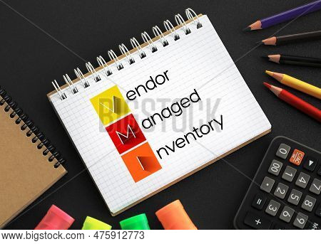 Vmi - Vendor Managed Inventory Acronym On Notepad, Business Concept Background
