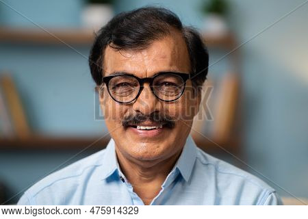 Close Up Head Shot Of Indian Senior Men Smiling By Looking At Camera - Conept Of Happiness, Positive