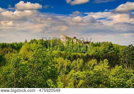 Highland Landscape In Summer Scenery. Man Climbing On Jurassic Limestone Rock, Situated Highland Are