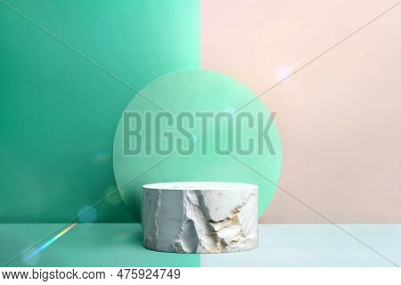White Round Marble Podium On Mint Color Background. Scene To Show Cosmetic Podructs. Showcase, Displ