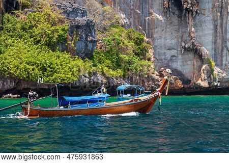 Old Traditional Thai Motorboat Made Of Wood For Fishing And Tourists On Excursions In The Andaman Se