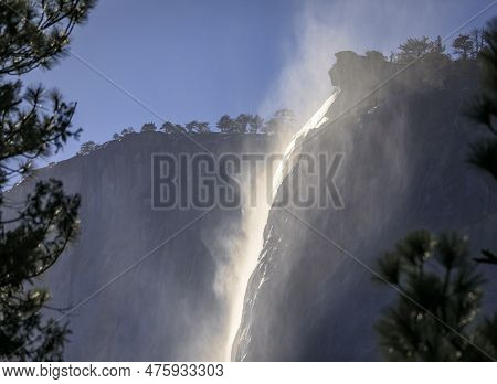 Scenic View Of The Famous Horsetail Falls With Rising Mist In The Yosemite National Park, Sierra Nev