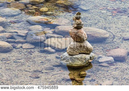 Stone Stack In The Lake Schmaler Luzin In Autumn Near Feldberg, Germany.