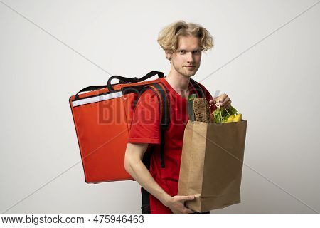 Sive View Handsome Delivery Man, Courier Carrying Package Bag Of Grocery Food And Drinks From Store,