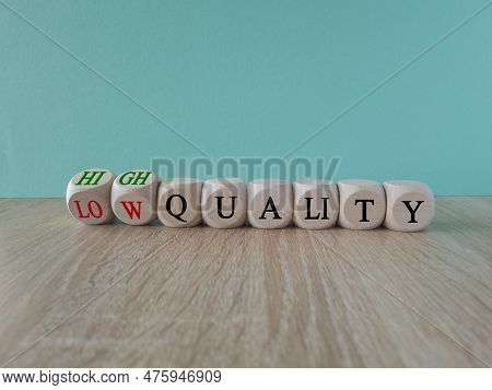 Low Or High Quality Symbol. Turned Wooden Cubes And Changed Words Low Quality To High Quality. Beaut