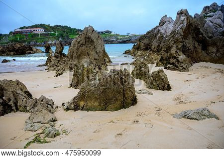 View On Playa De Toro In Llanes, Green Coast Of Asturias, North Spain With Sandy Beaches, Cliffs, Hi