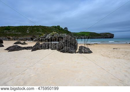 View On Playa De Borizo In Celorio, Green Coast Of Asturias, North Spain With Sandy Beaches, Cliffs,