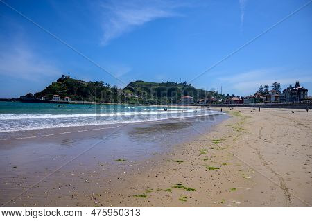 View On Playa De Ribadesella, Green Coast Of Asturias, North Spain With Sandy Beaches, Cliffs, Hidde