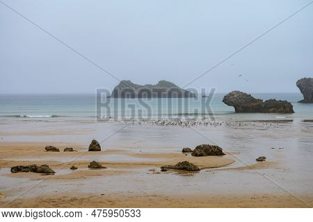 View On Playa De Palombina In Celorio Village, Green Coast Of Asturias, North Spain With Sandy Beach