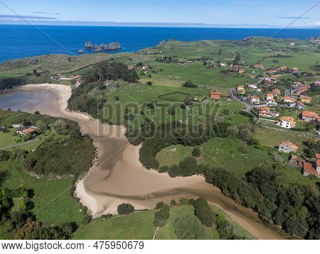 Aerial View On Playa De Poo During Low Tide Near Llanes, Green Coast Of Asturias, North Spain With S