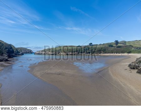 Aerial View On Playa De Poo During Low Tide Near Llanes, Green Coast Of Asturias, North Spain With S