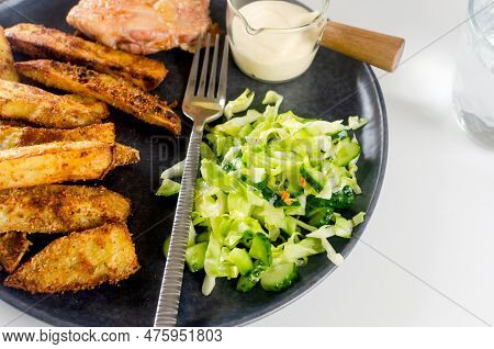 Fried Chiken Meat With Baked Potatoes In Spices And Salad On Plate For Tasty Lunch. Baked Chiken Wit
