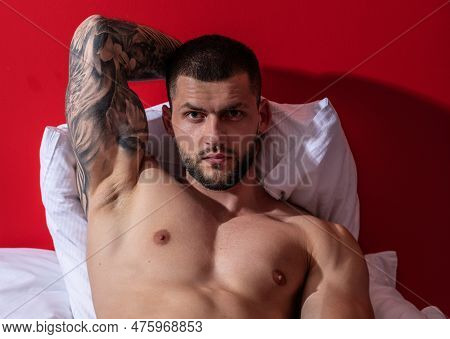 Sexy Male Naked Body, Sexy Shape. Sensual Muscular Hunk. Shirtless Man Model In Bed. Gay Sexy Model.