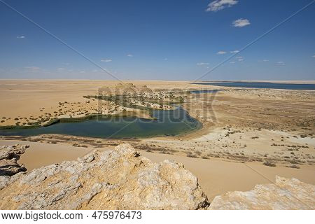 Panoramic Aerial View Over Remote African Egyptian Desert Landscape Valley With Oasis Salt Lake And 